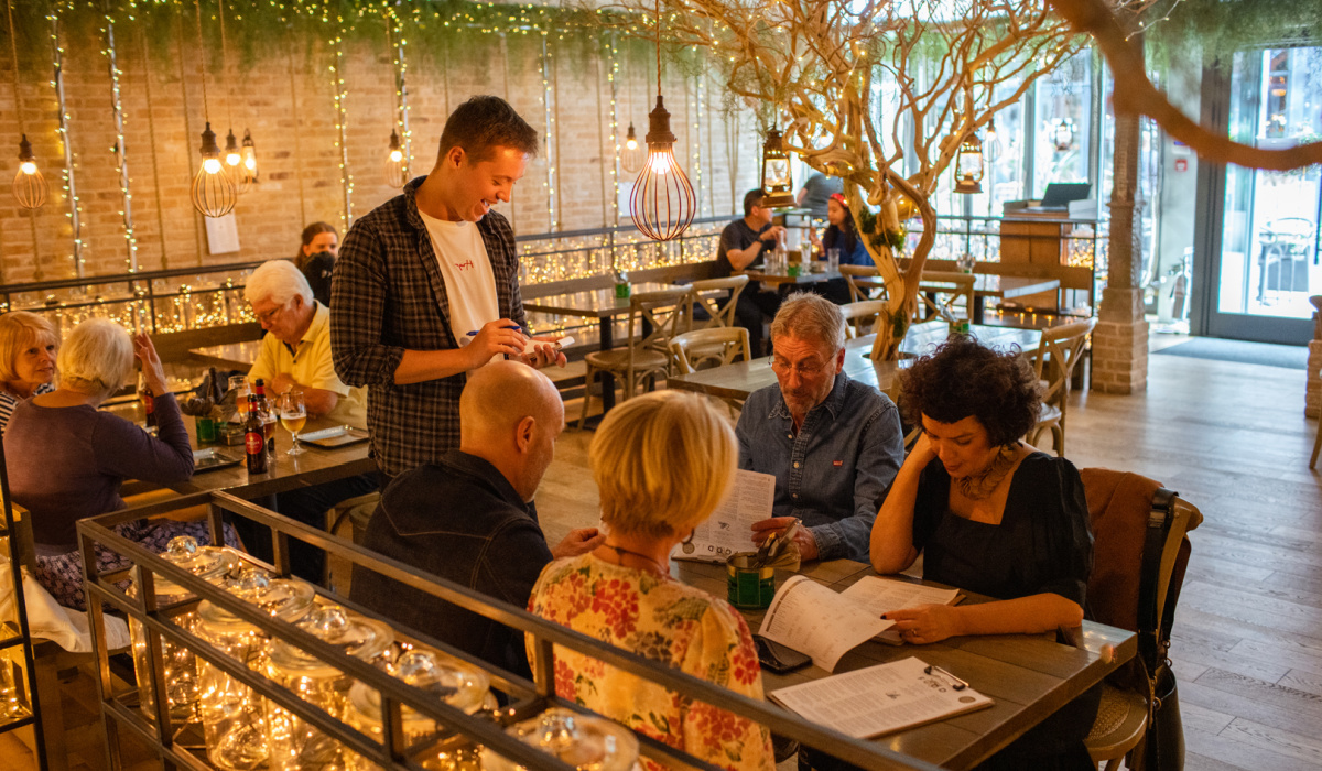 Friends dining at Mowgli restaurant.
